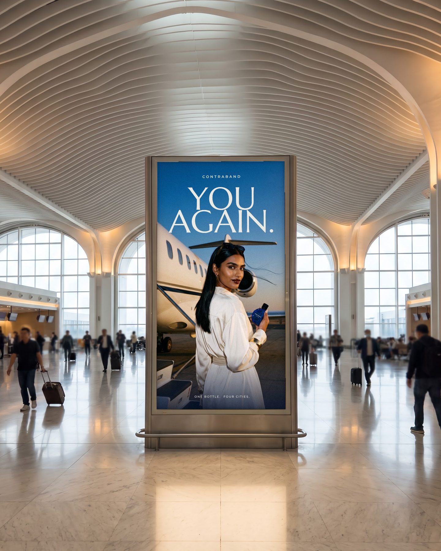 A double-height lightbox in an airport departures hall shows the Dubai airfield frame with YOU AGAIN. above her.